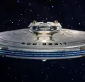 Magic Media Unreal Engine 5. The ship features blue and red accents, glowing engine sections, and intricate surface details, evoking a high-tech, sci-fi aesthetic.